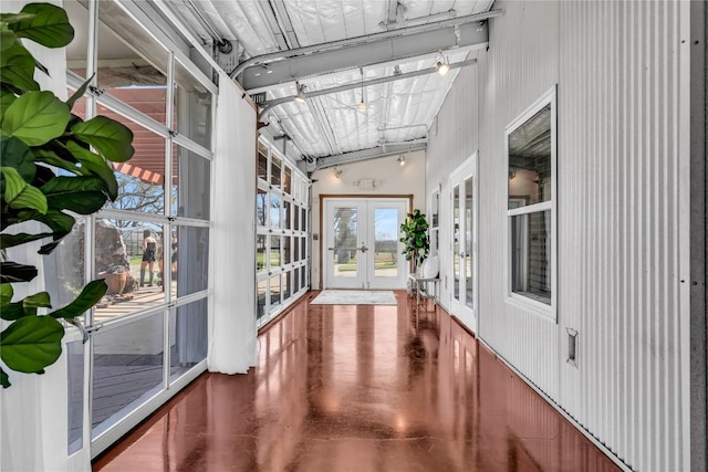 unfurnished sunroom featuring french doors