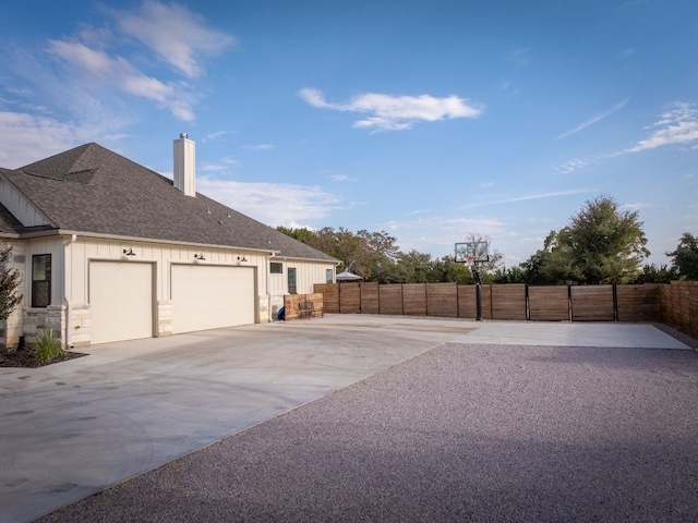 view of side of property with a garage