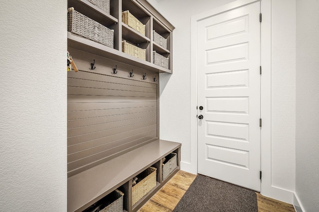 mudroom with light hardwood / wood-style floors