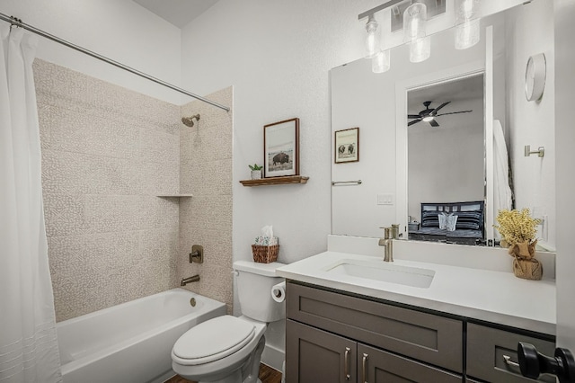 full bath featuring shower / bath combo with shower curtain, a ceiling fan, toilet, and vanity