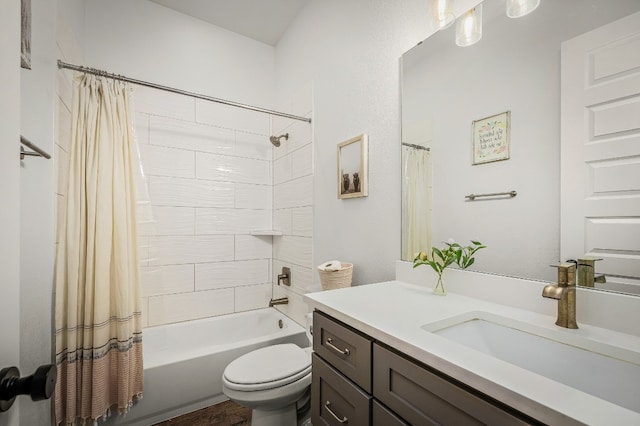 full bathroom with vanity, shower / bath combo with shower curtain, and toilet