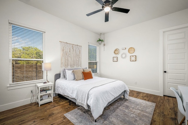 bedroom featuring dark wood-type flooring and ceiling fan