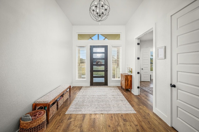 foyer featuring hardwood / wood-style flooring and an inviting chandelier