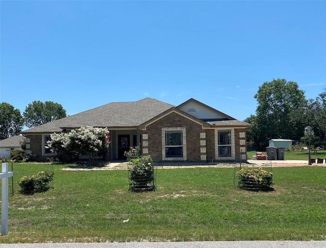 ranch-style house with a front lawn