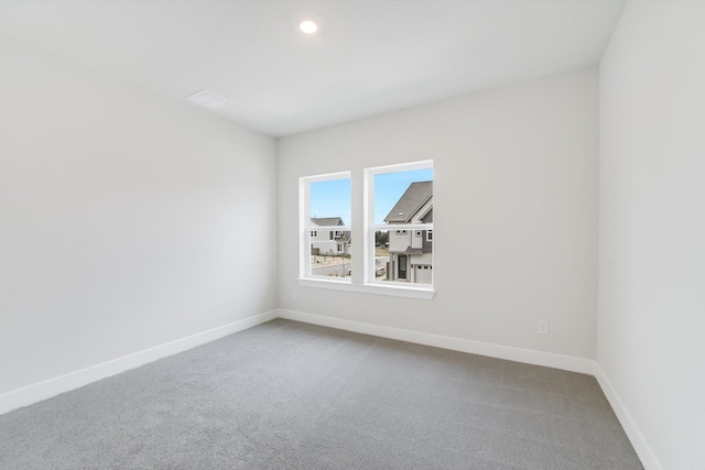 empty room with carpet flooring