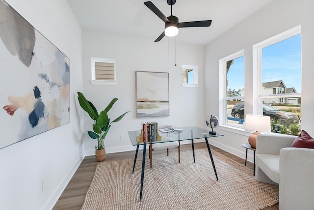 office space with ceiling fan and light wood-type flooring