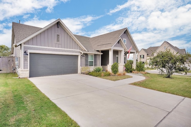 craftsman-style home featuring a front yard and a garage