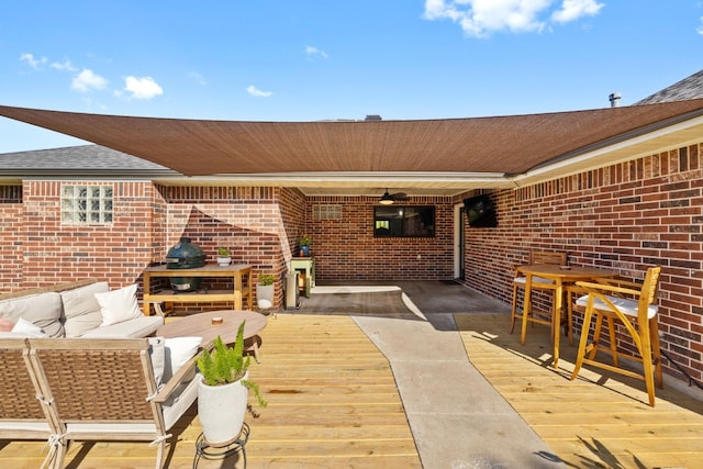 view of patio / terrace with a wooden deck and an outdoor living space