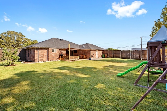 view of yard with a patio and a playground