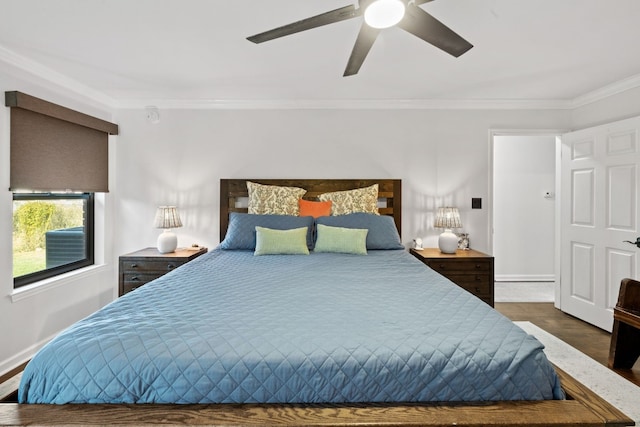 bedroom featuring crown molding, dark hardwood / wood-style floors, and ceiling fan