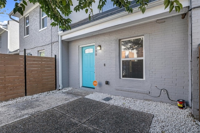 property entrance featuring a patio