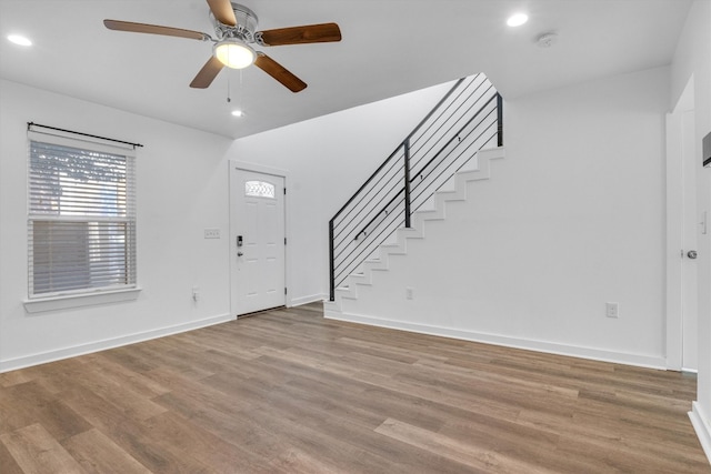 entrance foyer featuring light wood-type flooring and ceiling fan