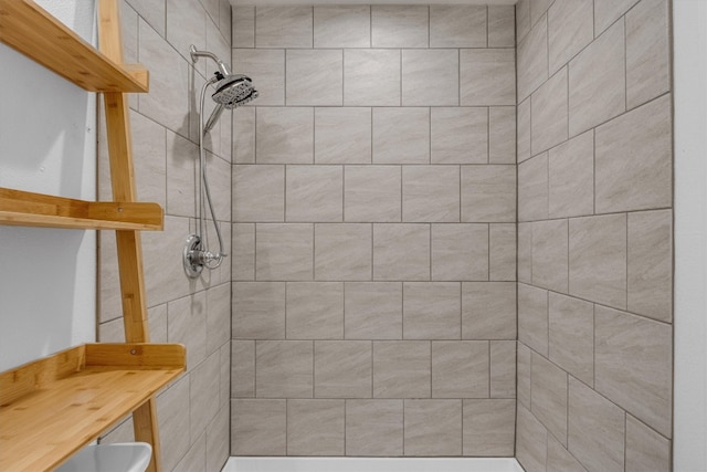 bathroom with tiled shower