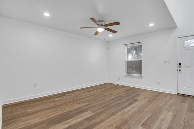 spare room featuring hardwood / wood-style flooring and ceiling fan