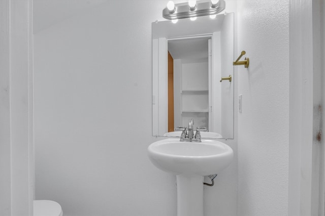 bathroom featuring toilet