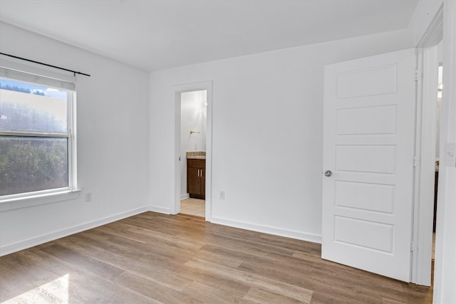 spare room featuring light hardwood / wood-style flooring