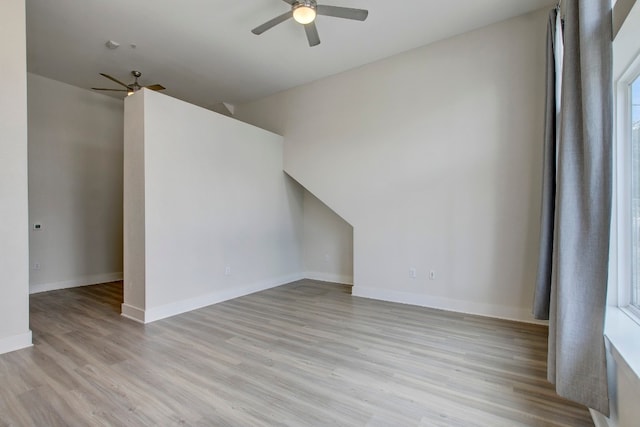 spare room featuring light hardwood / wood-style flooring and ceiling fan