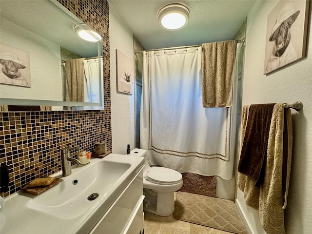 bathroom featuring vanity, toilet, tile walls, and a shower with shower curtain