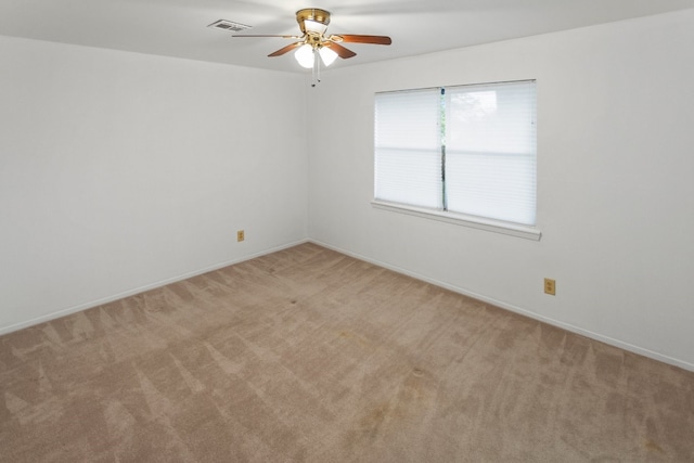 carpeted empty room with ceiling fan