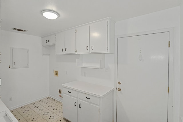 laundry room with hookup for a washing machine, electric dryer hookup, and cabinets