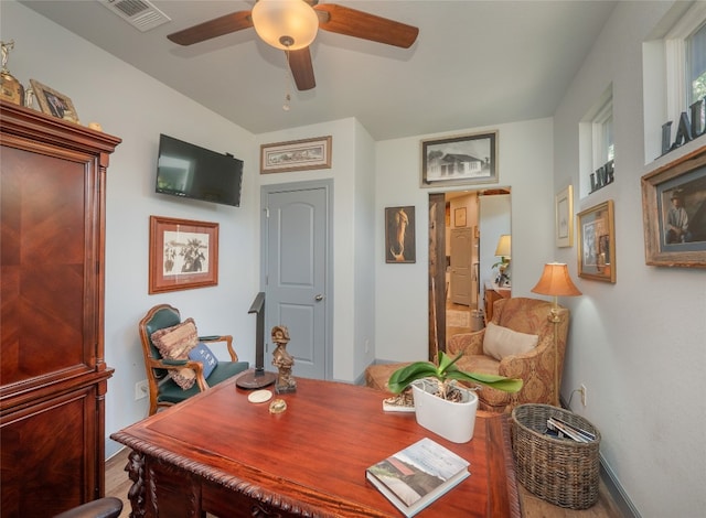 office space featuring hardwood / wood-style flooring and ceiling fan