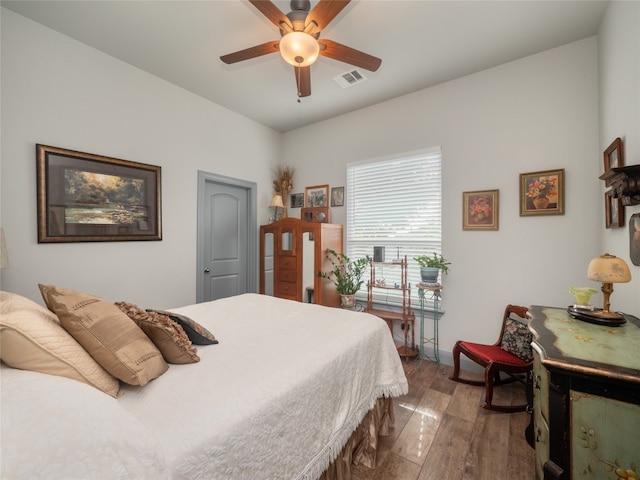 bedroom featuring ceiling fan and hardwood / wood-style floors