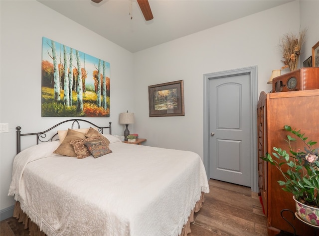 bedroom with wood-type flooring and ceiling fan