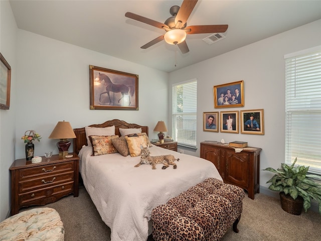 carpeted bedroom with ceiling fan