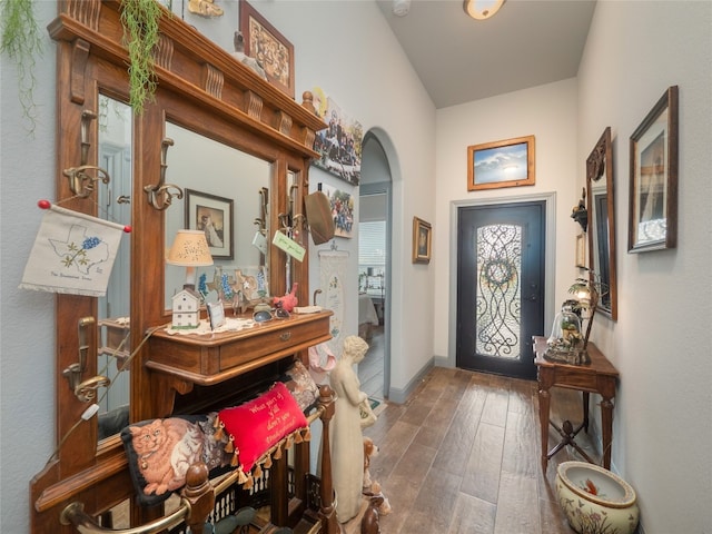 foyer with dark hardwood / wood-style flooring