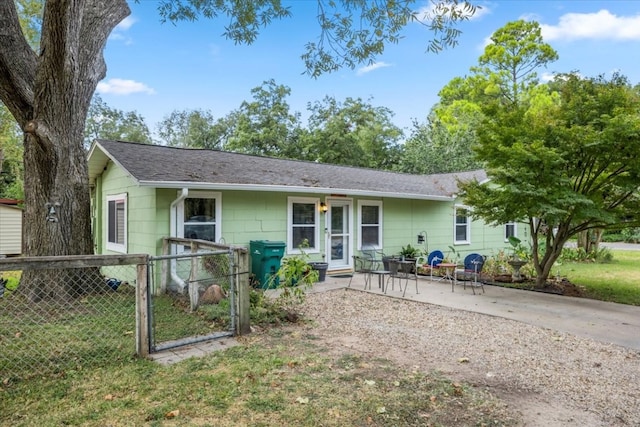 single story home featuring a patio and a front lawn