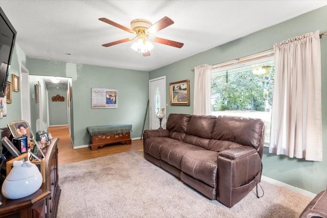 106 Hudgins St, Smithville, TX 78957 - carpeted living room featuring ceiling fan and baseboards