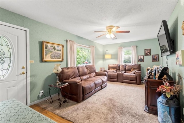 106 Hudgins St, Smithville, TX 78957 - living room featuring plenty of natural light, ceiling fan, and a textured ceiling