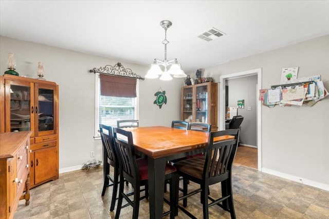 106 Hudgins St, Smithville, TX 78957 - dining area with baseboards and a chandelier