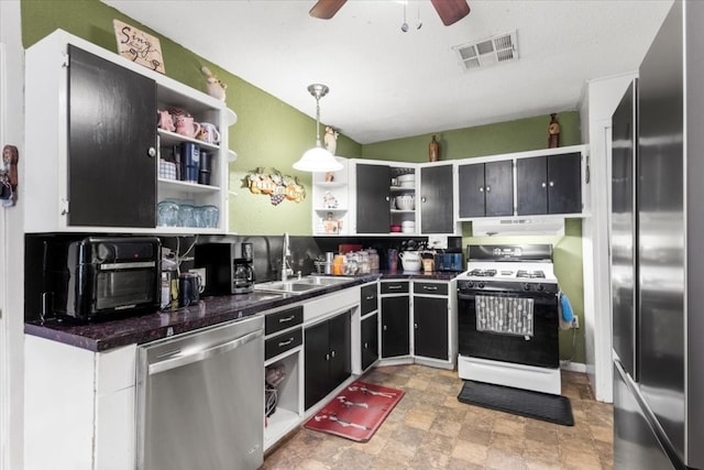 kitchen featuring hanging light fixtures, ceiling fan, sink, and stainless steel appliances