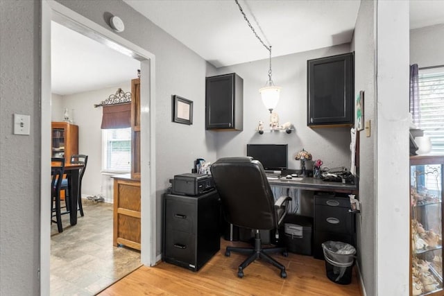 106 Hudgins St, Smithville, TX 78957 - office with light wood-style floors and a textured wall