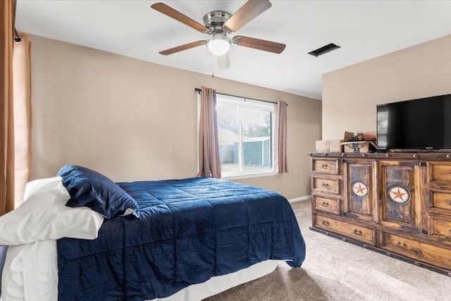 carpeted bedroom featuring ceiling fan