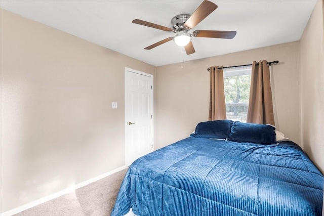 106 Hudgins St, Smithville, TX 78957 - carpeted bedroom with baseboards and a ceiling fan