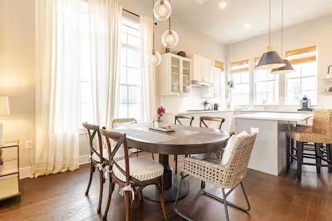 dining room with plenty of natural light and dark wood-type flooring