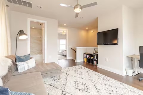 living area with recessed lighting, visible vents, ceiling fan, wood finished floors, and baseboards