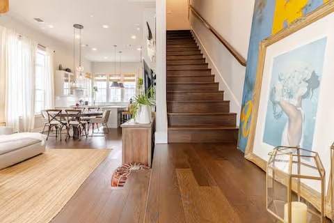 stairs featuring wood finished floors and recessed lighting