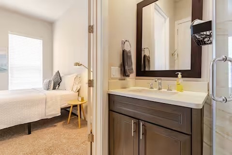 ensuite bathroom featuring vanity and ensuite bathroom