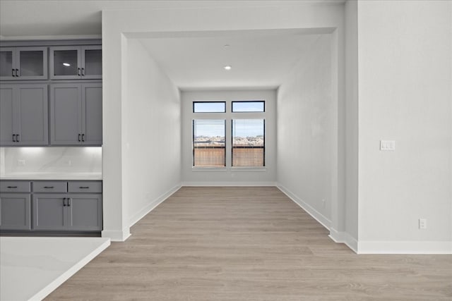 hall with light hardwood / wood-style flooring