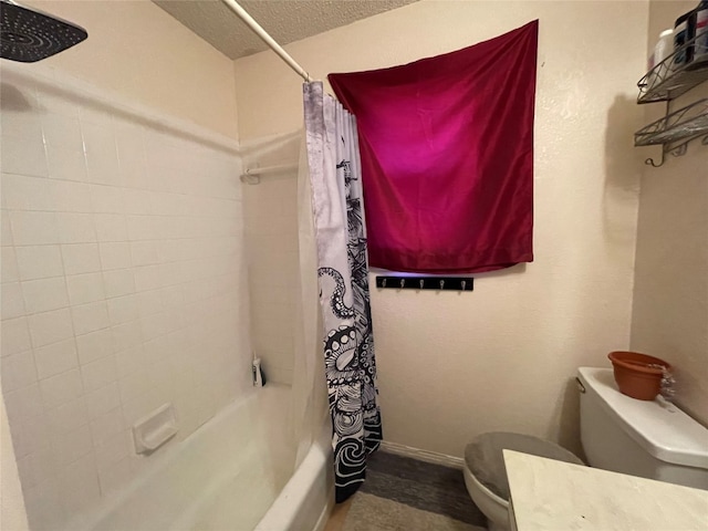 full bathroom featuring vanity, shower / bath combination with curtain, a textured ceiling, and toilet