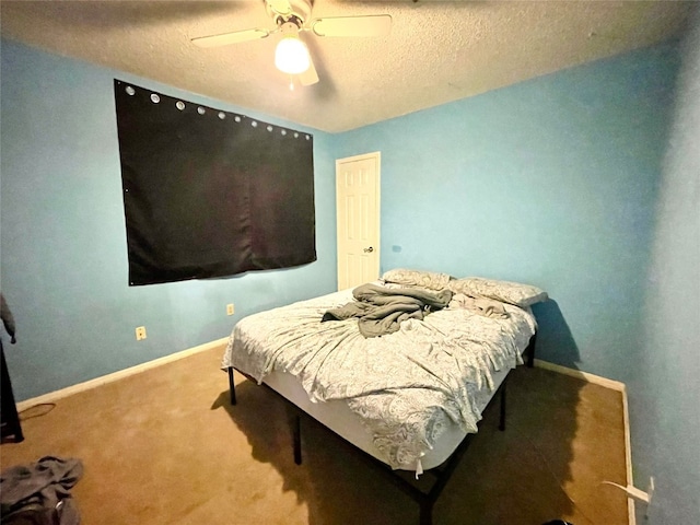 bedroom with carpet floors, a textured ceiling, and ceiling fan