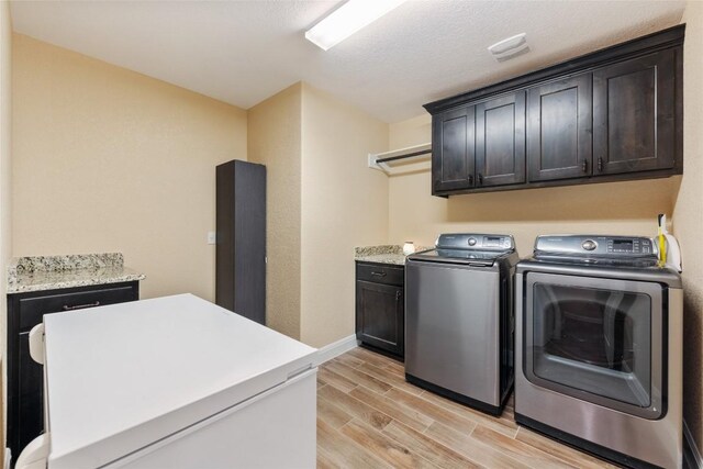 laundry area with cabinets and independent washer and dryer