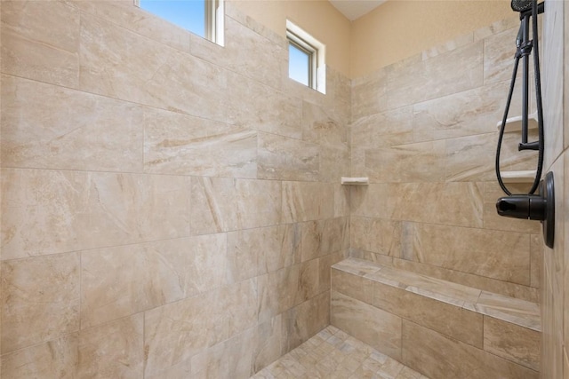 full bath featuring a tile shower