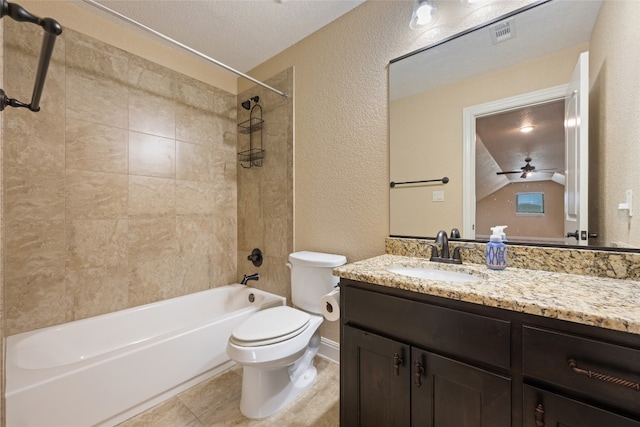 full bathroom featuring vanity, a textured ceiling, ceiling fan, toilet, and tiled shower / bath