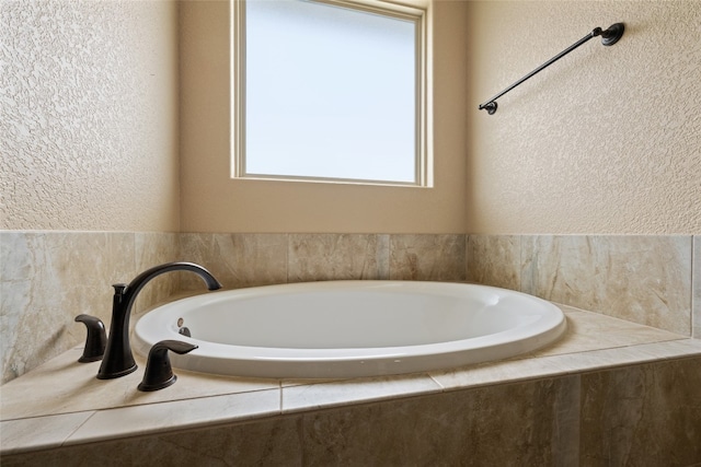 bathroom with tiled tub