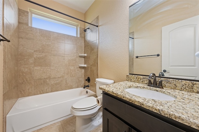 full bathroom with tile patterned flooring, vanity, toilet, and tiled shower / bath