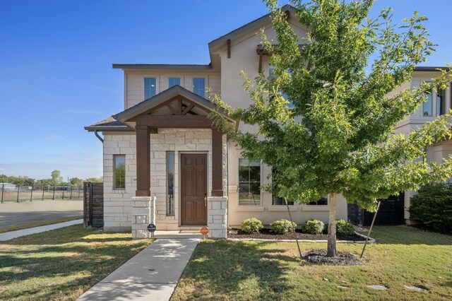 view of front of house featuring a front lawn